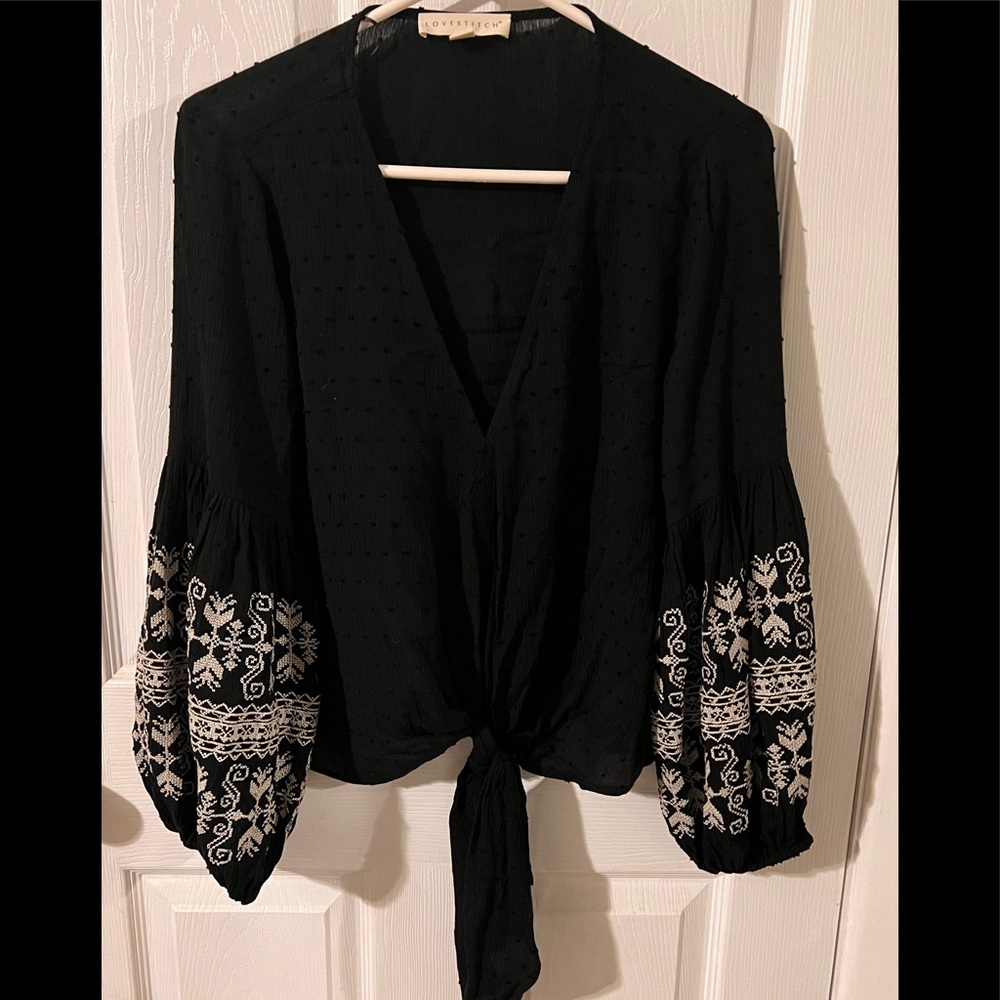 Vici Black top with ivory embroidery on sleeves.